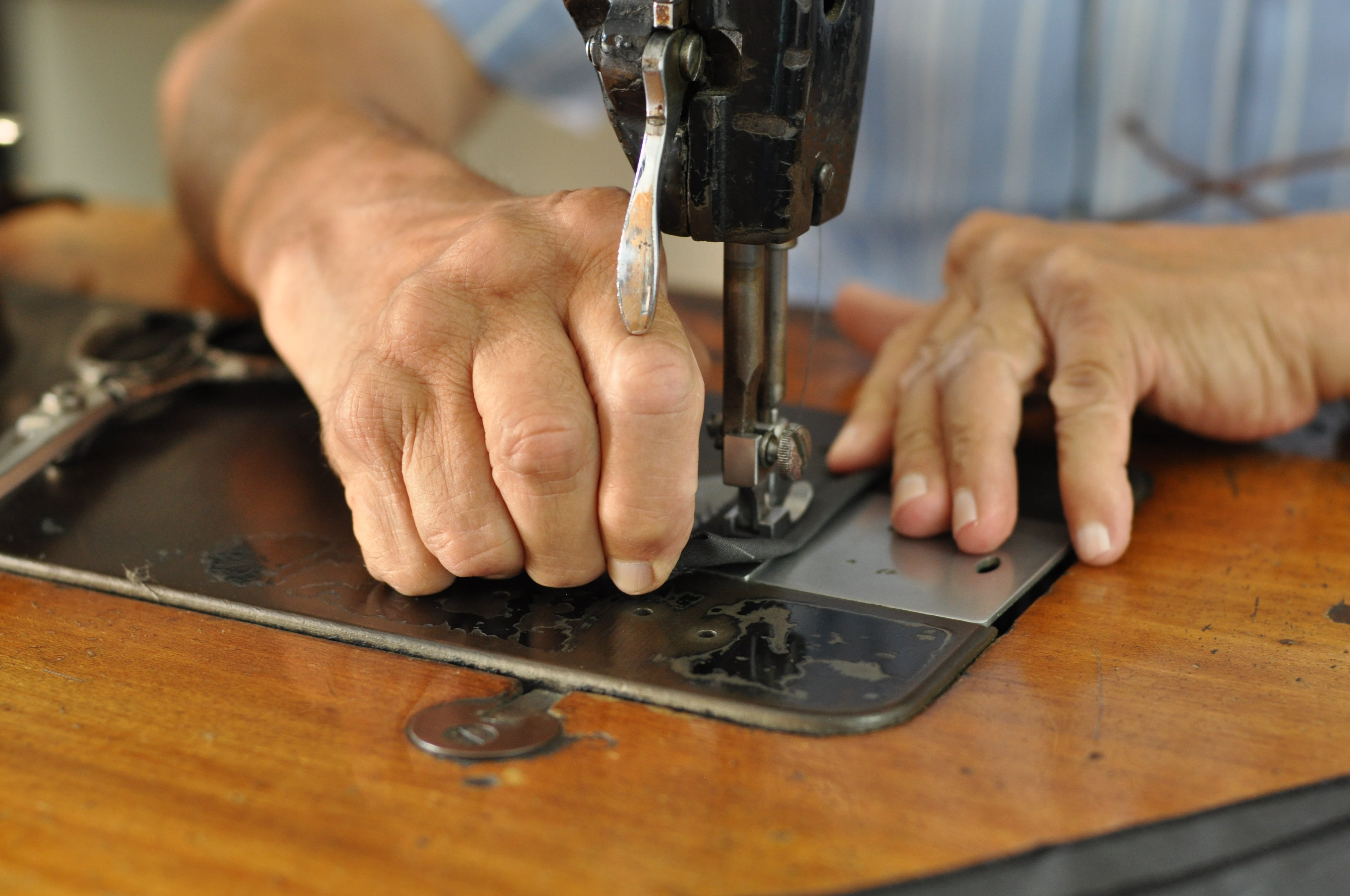 hands working at a sewing machine